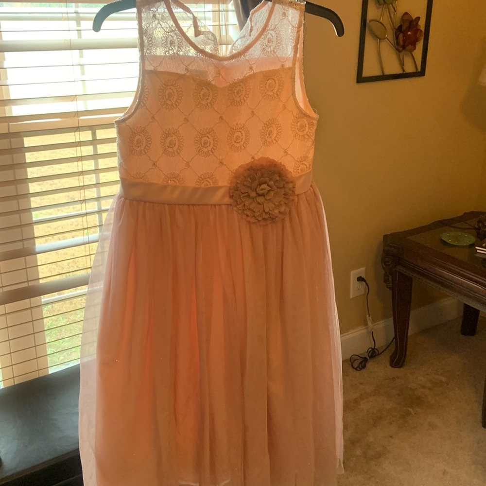 Pink dress with flower in the front.